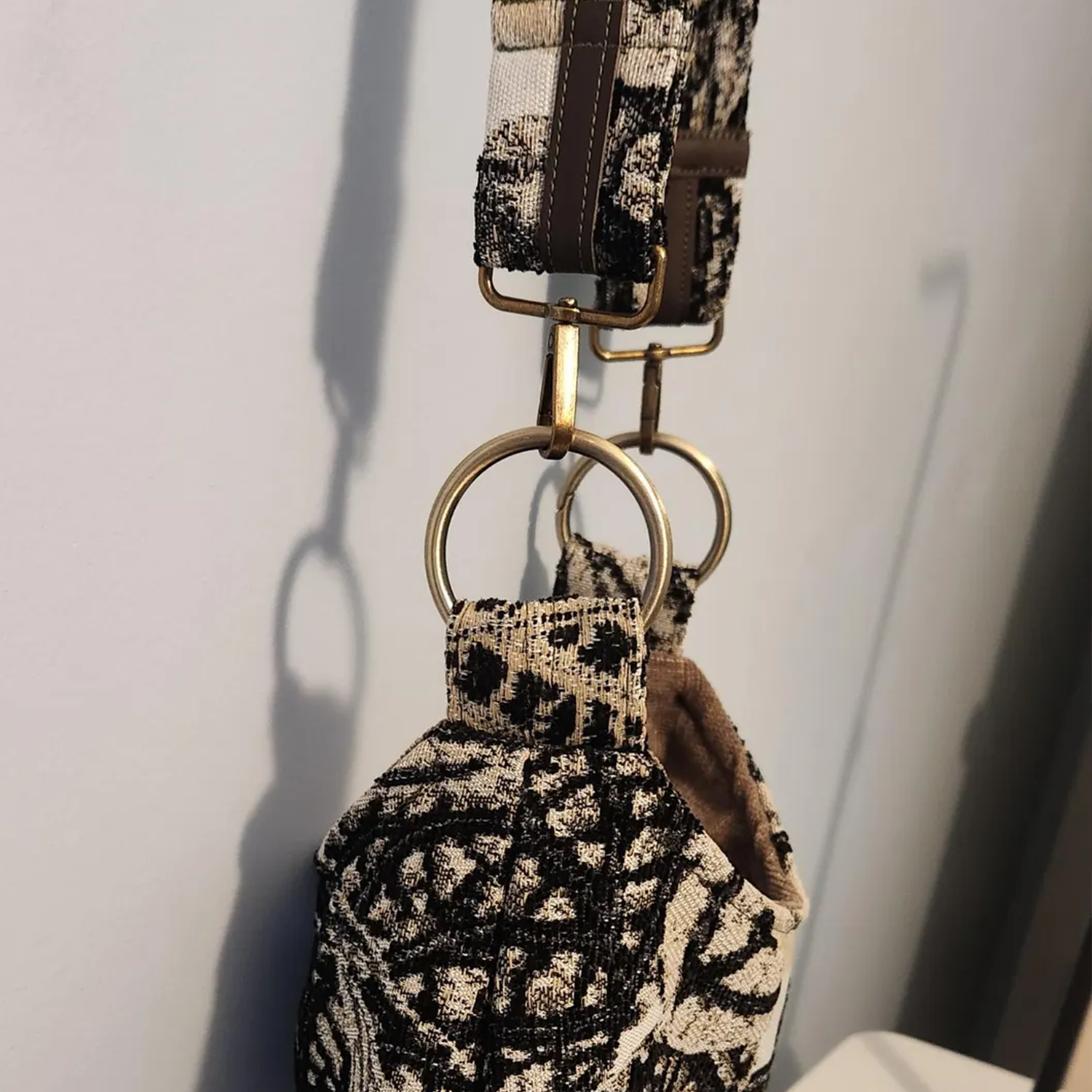 Monochrome Leaf Print Slouchy Shoulder Carryall With Bronze Metal Ring Hardware And Brown Lined Interior Slip Slot