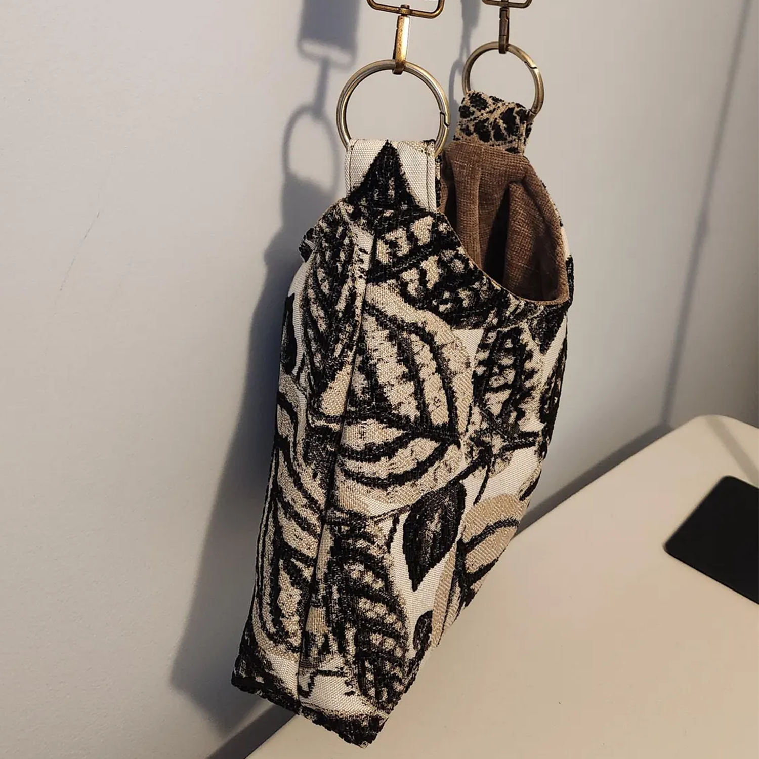 Monochrome Leaf Print Slouchy Shoulder Carryall With Bronze Metal Ring Hardware And Brown Lined Interior Slip Slot