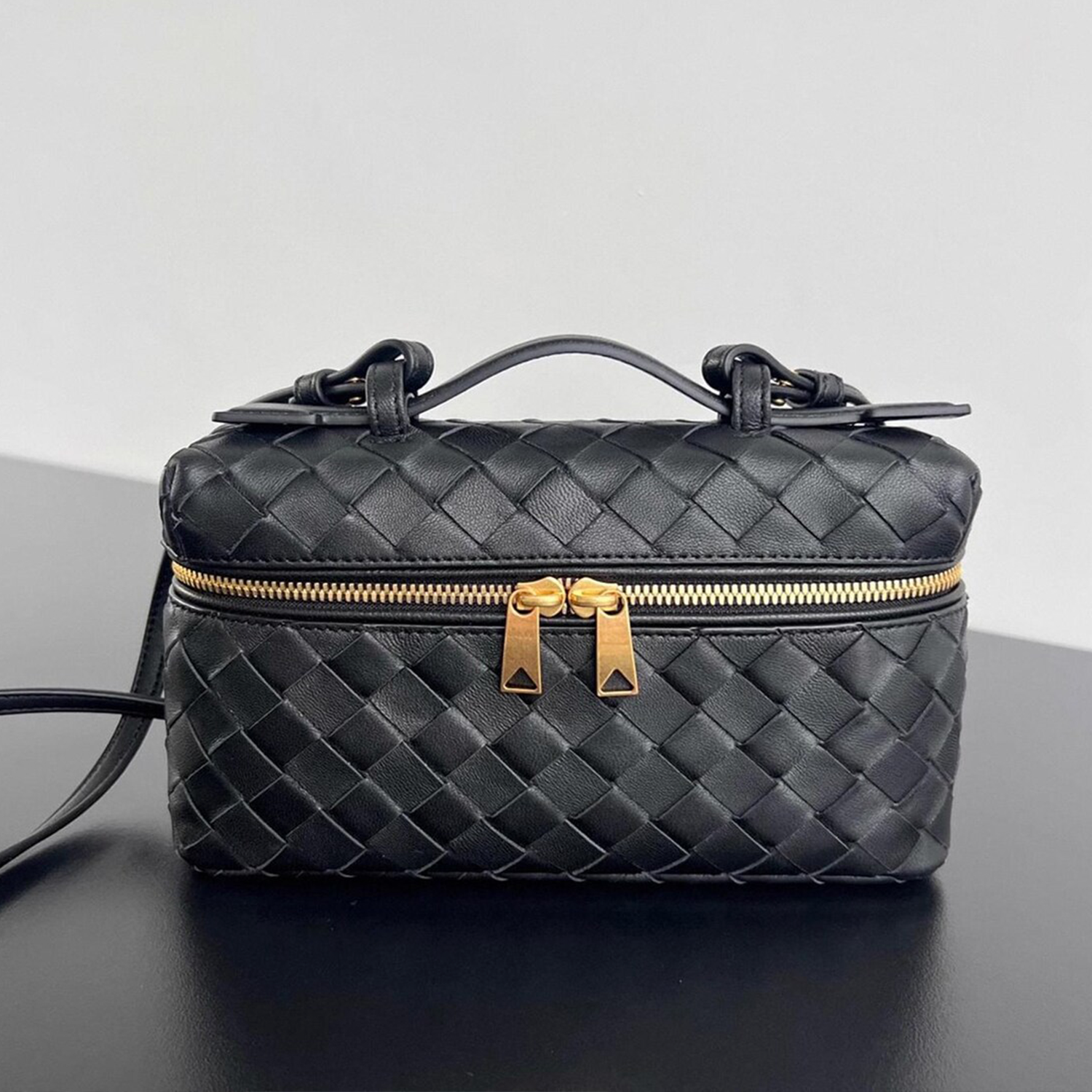 Interlaced Diamond Woven Box Carry Case With Gold Dual-Zip Hardware, Curved Top Grip And Detachable Side Hanging Band