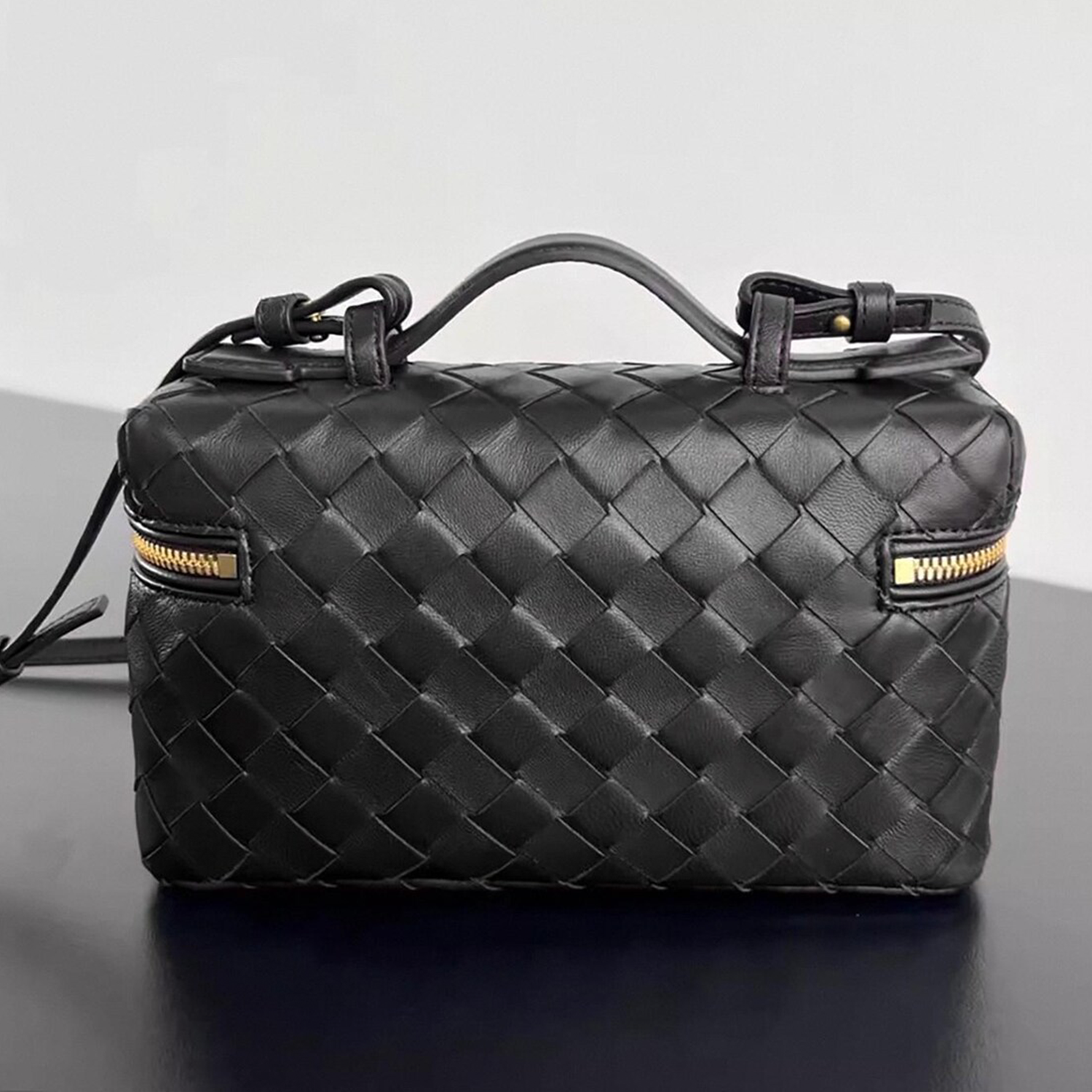 Interlaced Diamond Woven Box Carry Case With Gold Dual-Zip Hardware, Curved Top Grip And Detachable Side Hanging Band