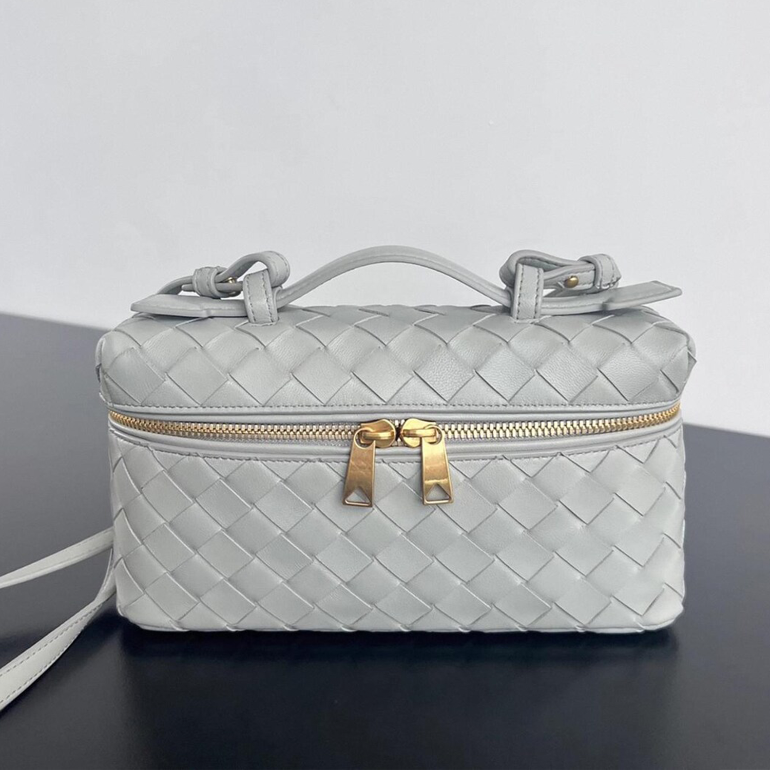 Interlaced Diamond Woven Box Carry Case With Gold Dual-Zip Hardware, Curved Top Grip And Detachable Side Hanging Band