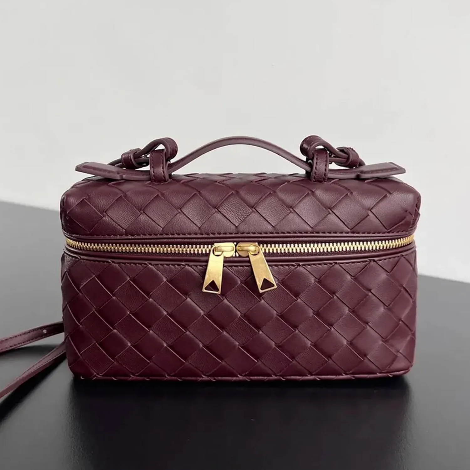 Interlaced Diamond Woven Box Carry Case With Gold Dual-Zip Hardware, Curved Top Grip And Detachable Side Hanging Band