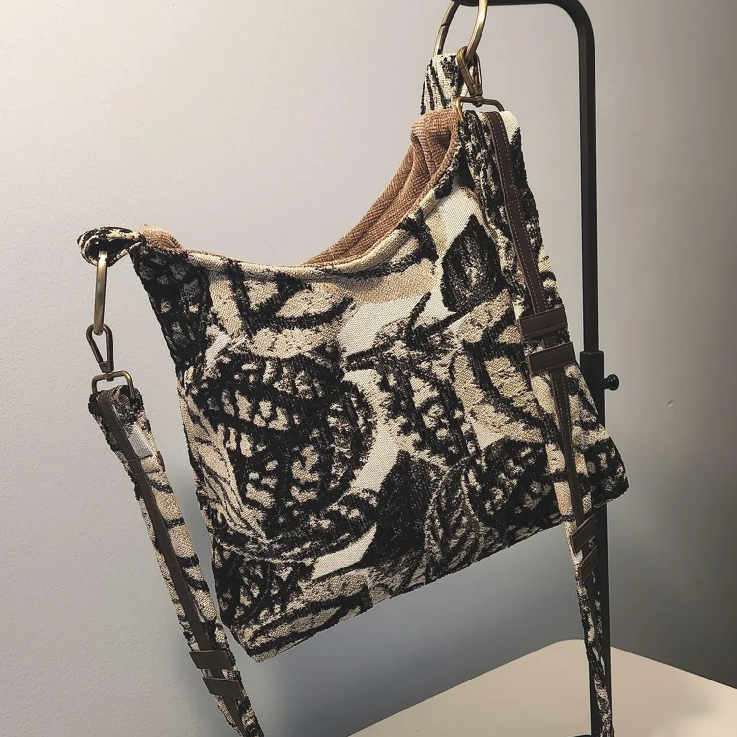 Monochrome Leaf Print Slouchy Shoulder Carryall With Bronze Metal Ring Hardware And Brown Lined Interior Slip Slot